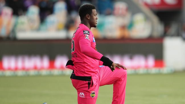 Carlos Brathwaite takes the knee for Sydney Sixers before a BBL match in Hobart last year Picture: Getty Images