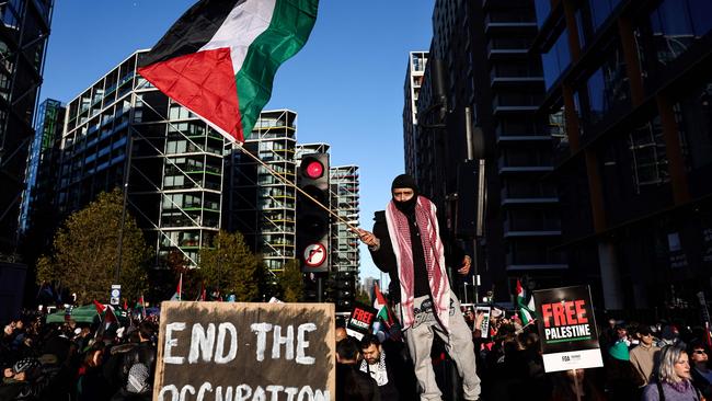 Protesters holding placards and flags take part in the 'National March For Palestine' in central London on November 11. Picture: AFP