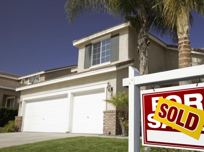 New Homes magazine - Feb 2018 - Red Sold For Sale Real Estate Sign in Front of House.