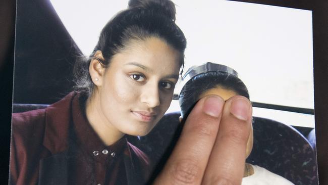 In this file photo taken on February 22, 2015, Renu Begum, eldest sister of Shamima Begum, holds a picture of her sister while being interviewed by the media in central London. Picture: AFP