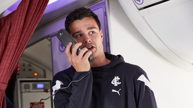 Jack Silvagni chatting to Anthony Koutoufides mid-flight. Picture: Virgin Australia