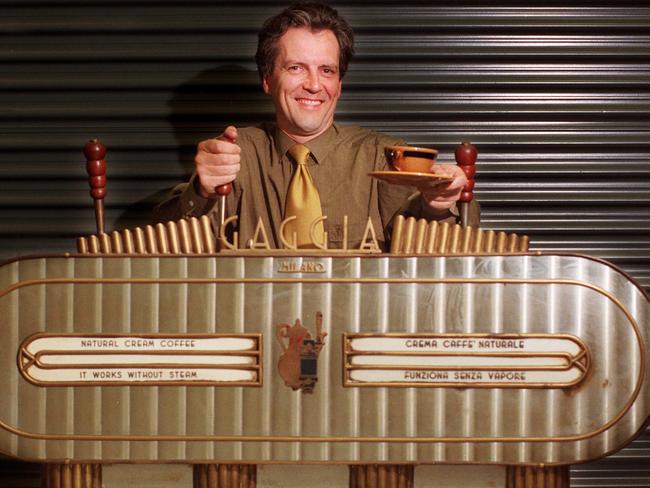 Richard Gillespie next to one of Melbourne's first espresso coffee machines, the Gaggia machine from the Don Camillo Restaurant, that opened in 1955. Picture: HWT Library.