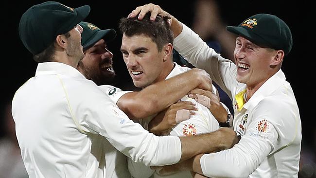 Pat Cummins celebrates after taking the wicket of Dimuth Karunaratne late on day two. Picture: Getty Images