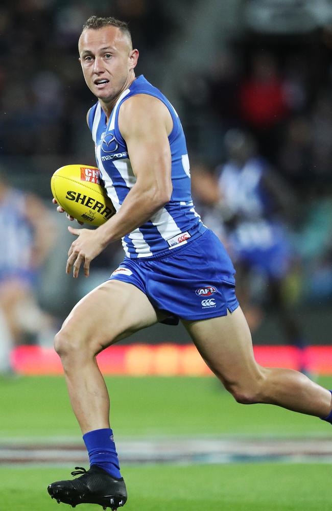 Billy Hartung on the run for the Roos.