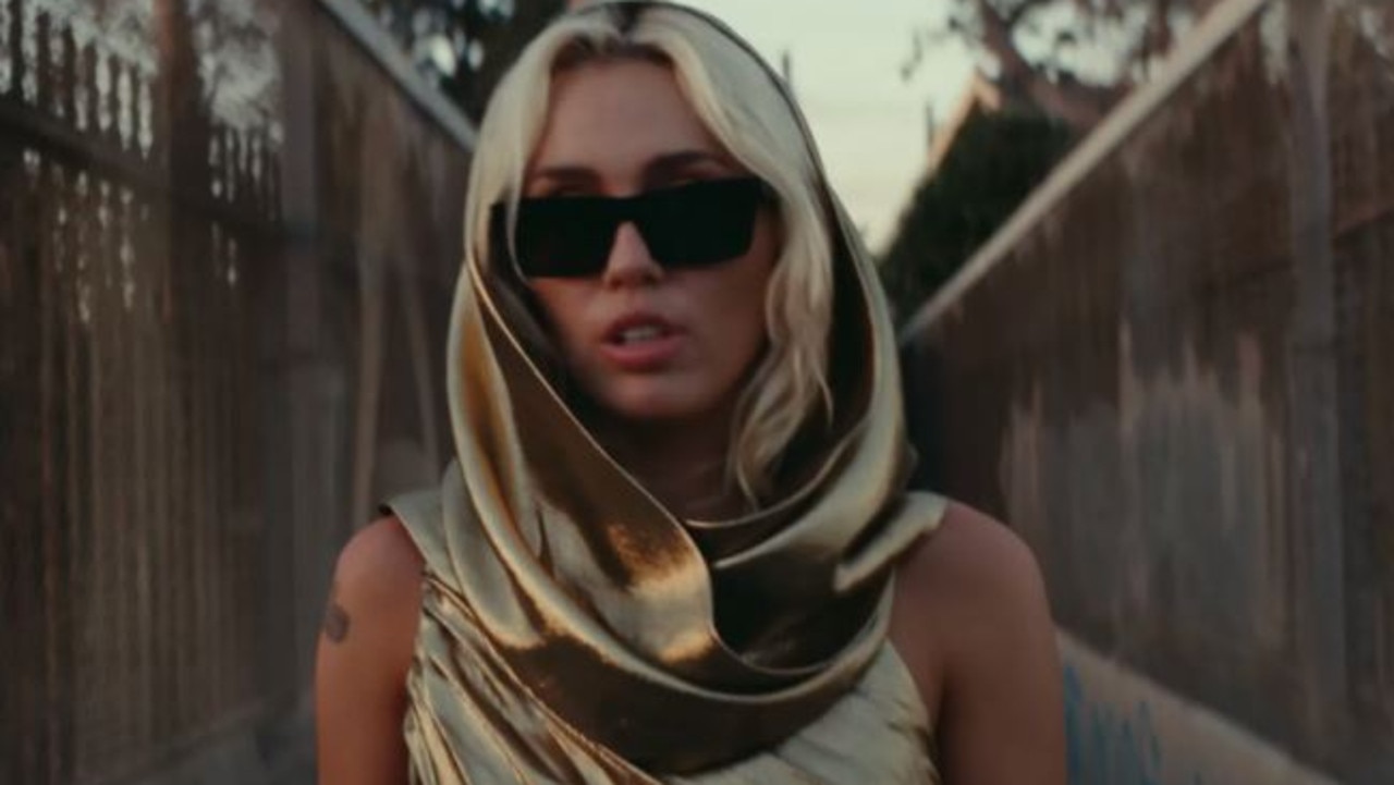 Cyrus, seen here in the music video for Flowers, has requested the lawsuit be dismissed.