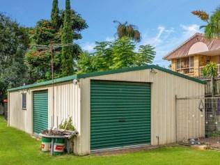 The backyard includes a large shed.