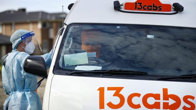 A taxi driver prepares for a test at a pop-up site in Clyde, a hotspot area home to a growing cluster. Picture: NCA NewsWire / Daniel Pockett