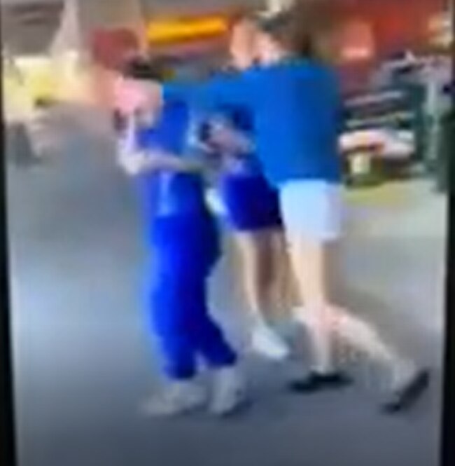 Disturbing footage of a Redcliffe schoolgirl striking another student in the head at a supermarket has emerged online. Picture: Supplied