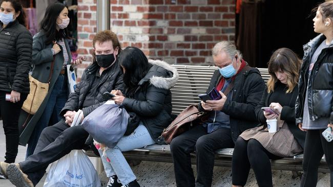 People are still wearing masks in Melbourne CBD as Covid cases continue to rise. Picture: David Geraghty