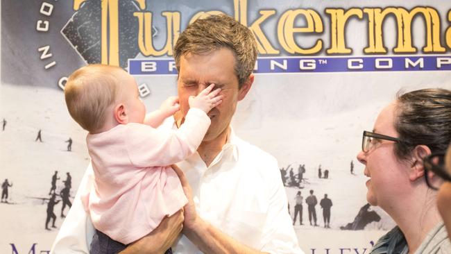 A young local gets hands-on with Democratic presidential candidate Beto O'Rourke at a meet-and-greet at Tuckerman Brewing in Conway, New Hampshire. Picture: Getty Images