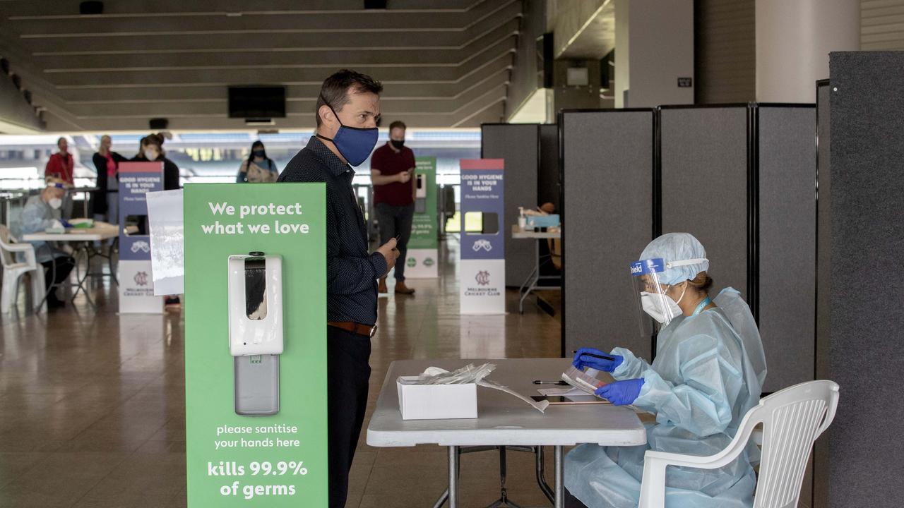 People queue for testing at the MCG testing site. Picture: David Geraghty