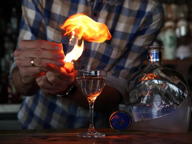 And what’s a martini without a dash of flambe? Worth every dollar just for the show. Picture: Jonathan Ng