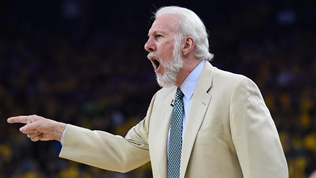 Gregg Popovich of the San Antonio Spurs signals to his team during Game One of the NBA Western Conference Finals against the Golden State Warriors at ORACLE Arena.