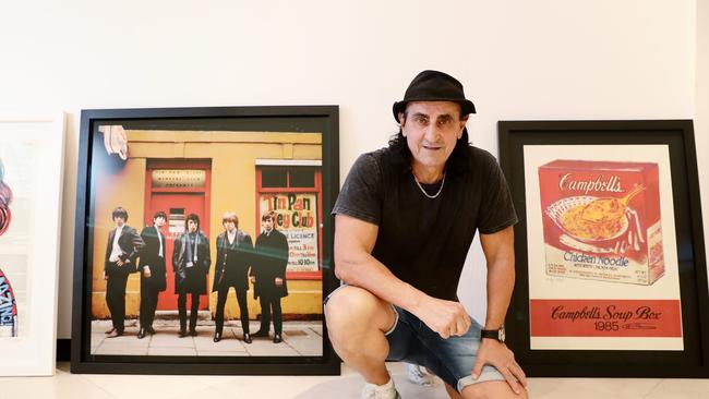 Millions of dollars worth of art will be on display for the grand reopening of the T Galleria fashion boutique on Friday night. The artwork is from the collection of acclaimed photographer Darryn Lyons, with many pieces available for sale. Lyons Gallery advisor Reno Nicastro sits amongst the artwork as it arrives at the T Galleria on Spence Street. Picture: Brendan Radke