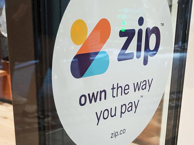 **FILE IMAGE**  Zip signage is seen on a storefront in Sydney, Tuesday, October 22, 2019. By the end of December 2019, 1.8 million customers had an active Zip account that allows them buy now and pay later without a credit card at 20,875 merchants, including Amazon Australia. (AAP Image/Derek Rose) NO ARCHIVING