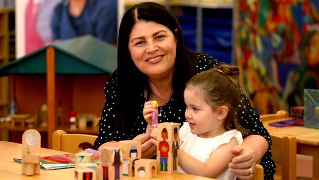 Education Minister Grace Grace with three-year-old Gigi Caso at Lady Gowrie Love Street Child Centre in Fortitude Valley. Photo: Steve Pohlner.