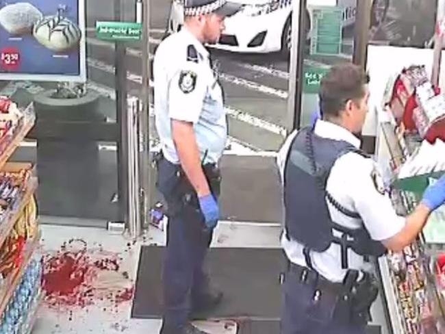 The gory scene as police attend the 7-Eleven after Amati’s bloody attack, which left two victims with head and facial injuries.