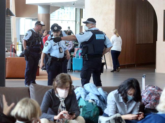 Police patrolling the Rydges Hotel where returning travellers have been placed in 14 day quarantine. Picture: Matrix Media