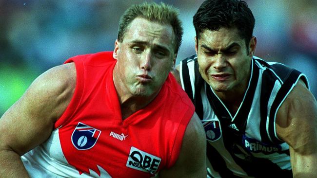 Mal Michael says he’s remembered as much for playing on Plugger when he kicked his 1300th goal than he is when for his three premierships with Brisbane.