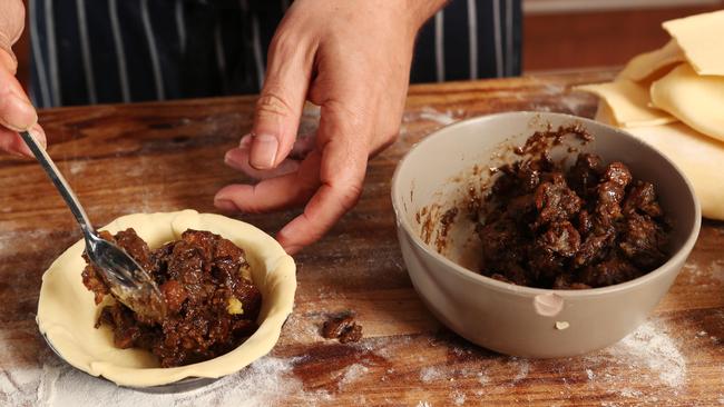 Stuffing the perfect pie. Picture Rebecca Michael.