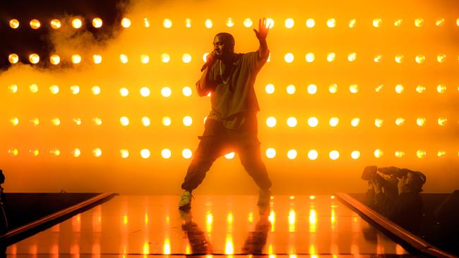 Kanye West performing in concert.