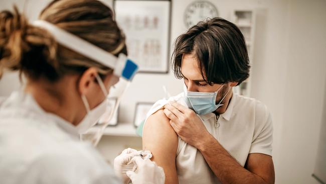 Catching Covid not enough to protect you. Picture: istock Medical doctor giving injection to make antibody for coronavirus