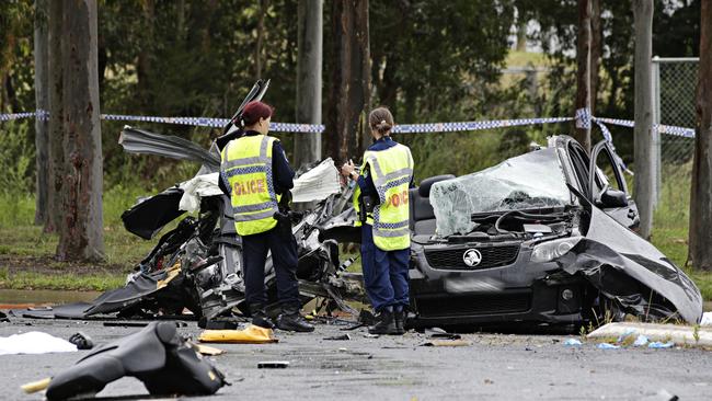 Police look over the crime scene. Picture: Adam Yip