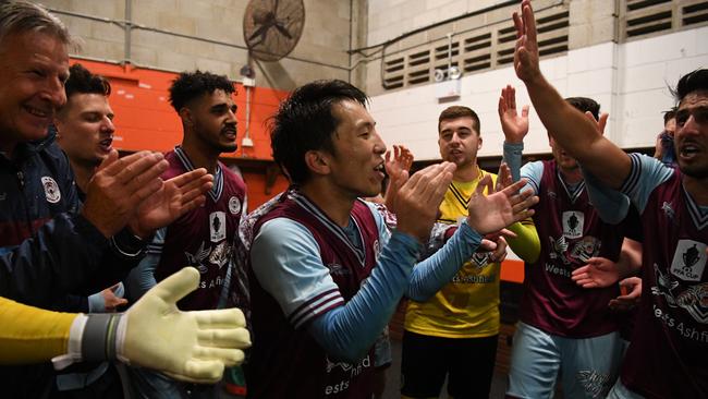 Tasuku Sekiya celebrates Tuesday night’s famous FFA Cup win over Melbourne Victory with APIA Leichhardt teammates. Picture: AAP