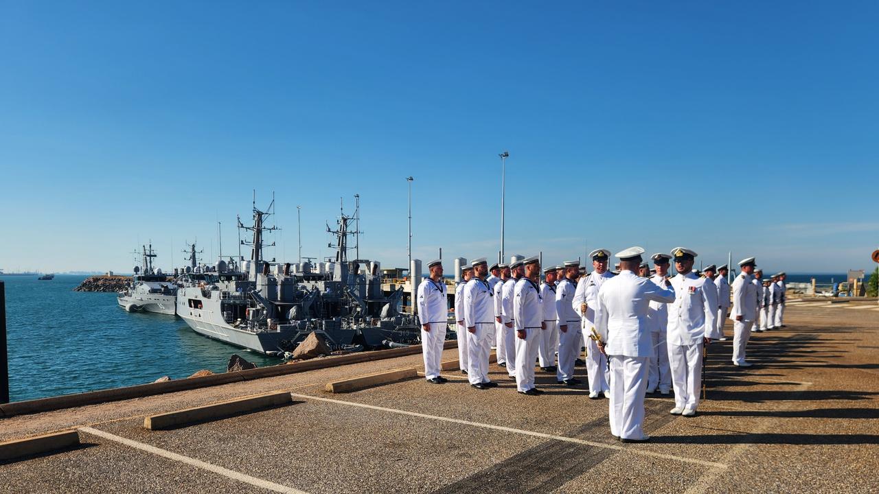 Commodore Morrison inspecting the crew of the two ships.