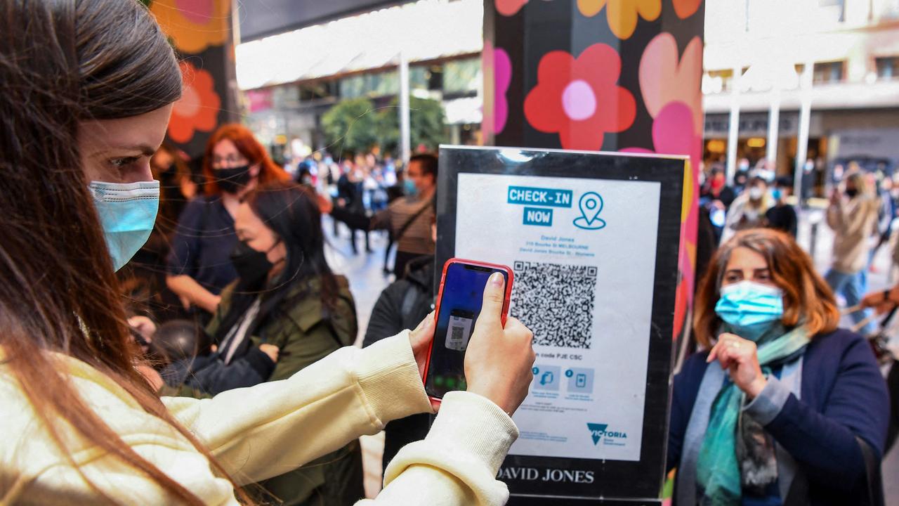 This file photo shows a customer scanning a QR code. Picture: William West/AFP