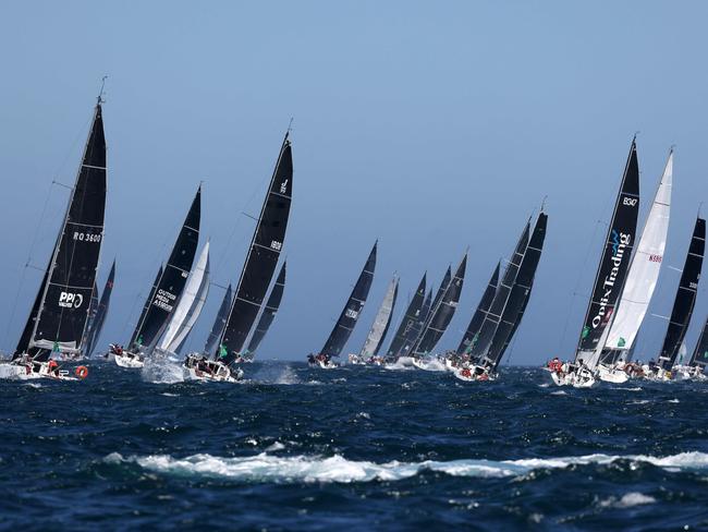 The middle pack of yachts sailing out of Sydney Harbour. Picture: David Gray / AFP