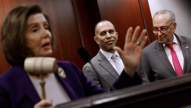 Senate majority leader Charles Schumer, right, talks with house minority leader Hakeem and Nancy Pelosi last March. Picture: Getty Images via AFP