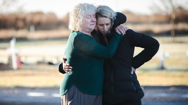 Journalist Virginia Tapscott and her mother Lynne Tapp at Narrabri Lawn Cemetery, where Virginia’s sister Alex was buried after her death by overdose. Virginia is seeking justice for her sister in new podcast My Sister’s Secrets. Picture: Ryan Osland