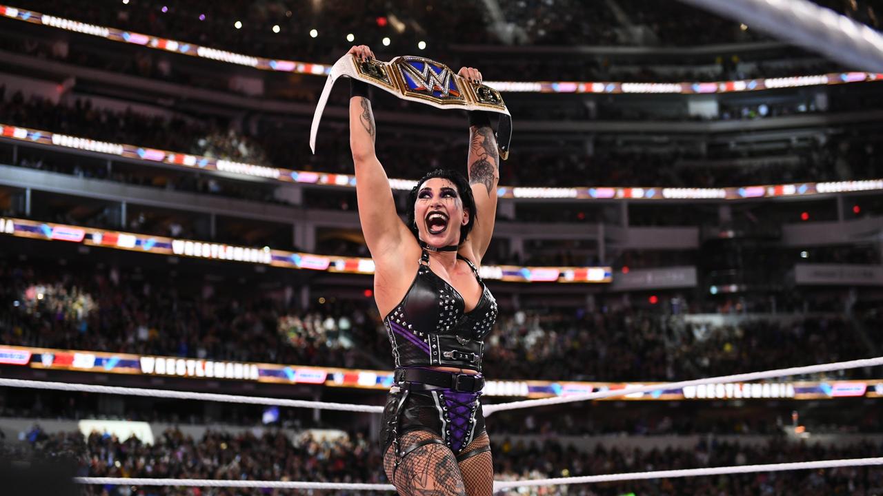 Rhea Ripley holds the title belt after defeating Charlotte Flair in the WWE Smackdown women's championship during WrestleMania 39. Picture: WWE