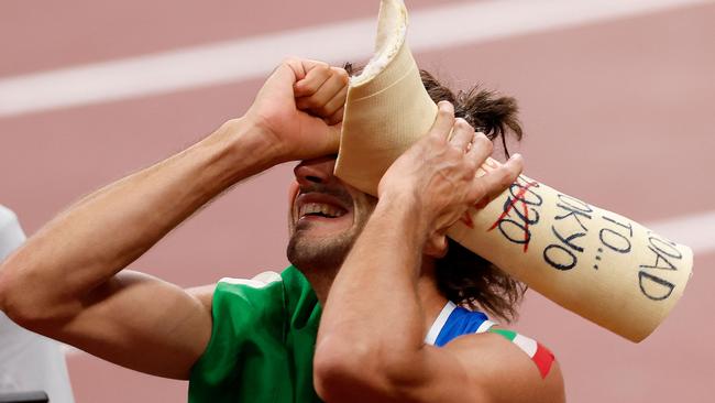 Italy’s Gianmarco Tamberi celebrates his high jump gold medal. Picture: AFP