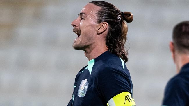 ABU DHABI, UNITED ARAB EMIRATES - JANUARY 6: Australia's captain Jackson Alexander Irvine reacts after a goal by Mitchell Thomas Duke in the international friendly against Bahrain on January 6, 2024 in Abu Dhabi, United Arab Emirates. (Photo by Martin Dokoupil/Getty Images)