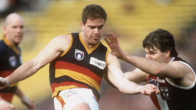 Adelaide’s Mark Ricciuto takes on St Kilda’s Danny Frawley in 1995 at Waverley. (Picture: Tony Feder from Sporting Pix.