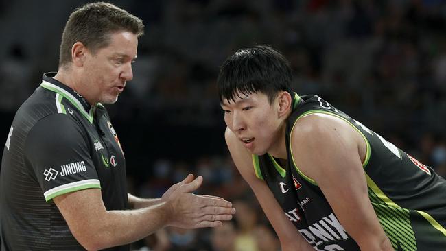 Mitchell with prized Chinese recruit Zhou Qi during a recent Phoenix game. Picture: Getty Images