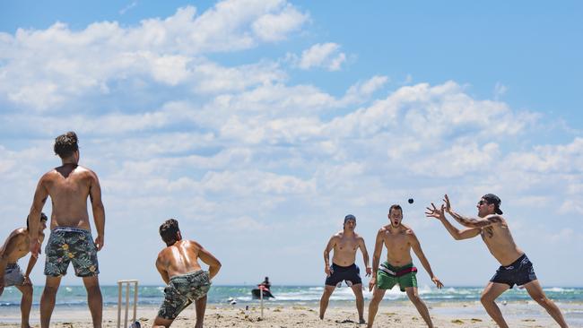 Beachgoers enjoy a spot of beach cricket at Capel Sound beach. Picture: Jason Edwards