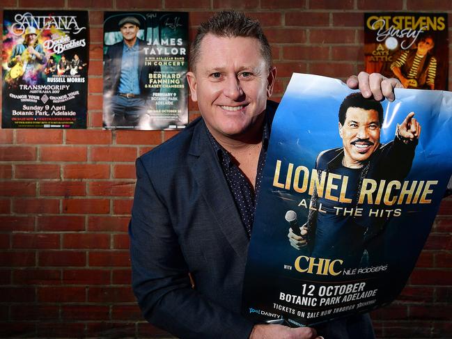 Managing Director at Space Events  Phil Rankine with some of the promotional posters of the  past and upcoming acts he has promoted over the last year. Pictured in Cordwainers Lane, Adelaide. picture: Bianca De Marchi