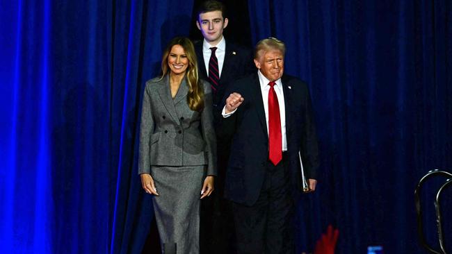 Former US President and Republican presidential candidate Donald Trump arrives for an election night event alongside former US First Lady Melania Trump and his son Barron `Trump at the West Palm Beach Convention Center in Florida. Picture: Jim Watson/AFP