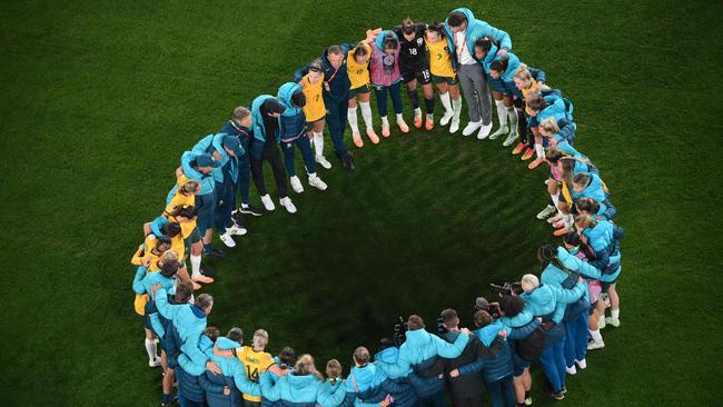 Australia's team reacts moments after defeating Ireland. Picture: AFP