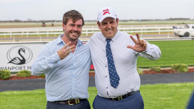 Ned Taylor (left) and Aaron Bain (right) celebrate a metro treble at Murray Bridge in March. Picture: Makoto Kaneko