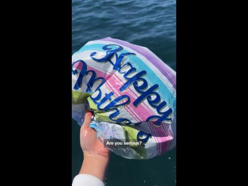 ‘Heartbreaking’ moment family pulls dozens of balloons from the sea