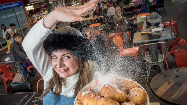 Preston Market. Jess Pelich sells the only Pirozhki in Melbourne. They are like a Russian donut and are all handmade from a family recipe, and are a traditional Eastern European snack - deep fried dough with savoury and sweet filling. Jess dusts a plate of apple and sour cherry piroshki with sugar at the Preston Market. Picture: Jake Nowakowski