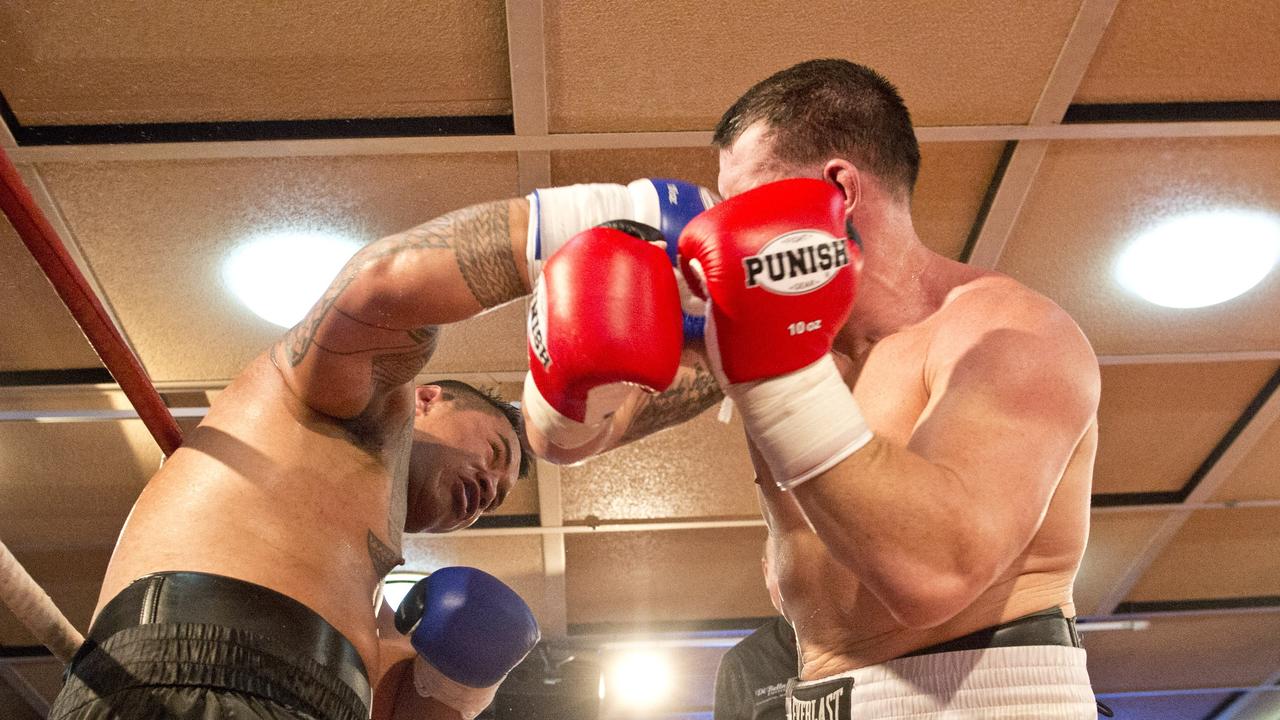 Paul Gallen and Herman Ene-Purcell fight it out in Toowoomba. Friday, Jan 29, 2016.