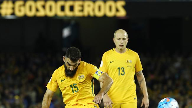 Australia's Mile Jedinak takes a free kick in the first half. Picture: George Salpigtidis