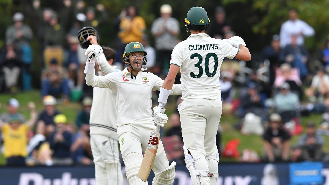 Alex Carey and Pat Cummins got the job done for Australia. (Photo by Sanka Vidanagama / AFP)