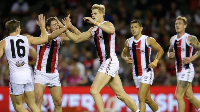 MELBOURNE, VICTORIA — APRIL 30: Nick Riewoldt of the Saints celebrates a goal with team mates during the round six AFL match between the Melbourne Demons and the St Kilda Saints at Etihad Stadium on April 30, 2016 in Melbourne, Australia. (Photo by Darrian Traynor/AFL Media/Getty Images)