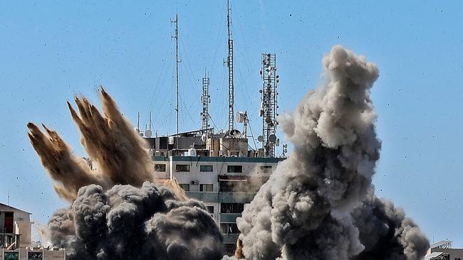 Smoke billows as a bomb is dropped on the Jala Tower during an Israeli airstrike in Gaza city on May 15. Picture: AFP